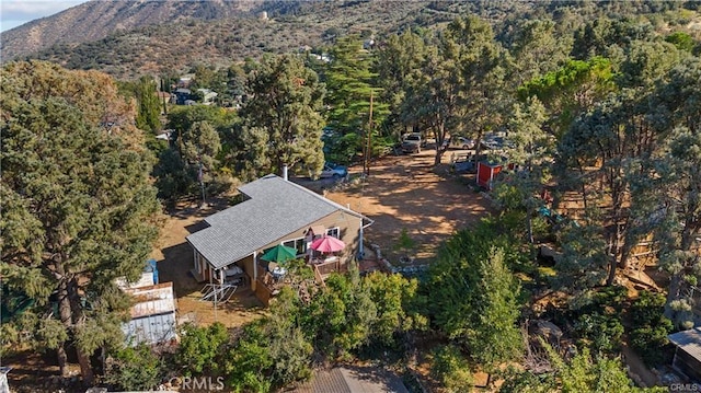 birds eye view of property with a mountain view