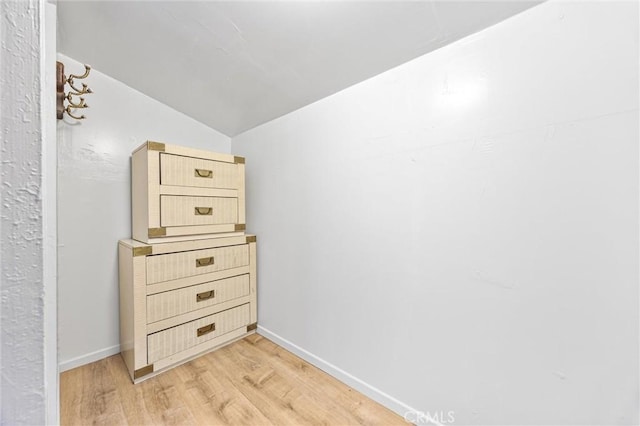 interior space featuring wood finished floors and baseboards