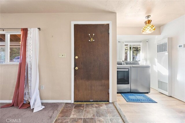 entrance foyer featuring separate washer and dryer