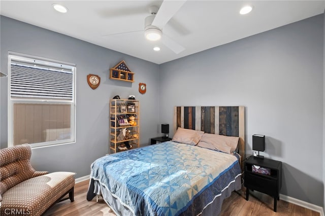 bedroom featuring ceiling fan and hardwood / wood-style floors