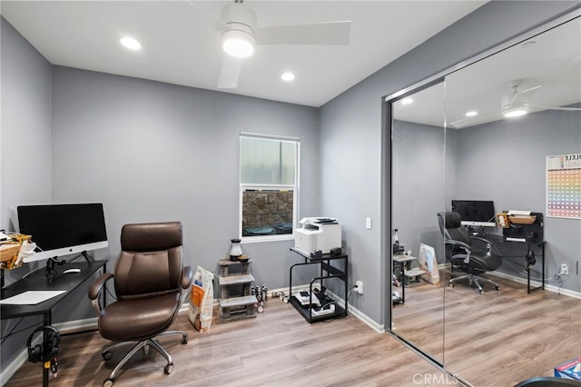 office area with ceiling fan and light hardwood / wood-style flooring