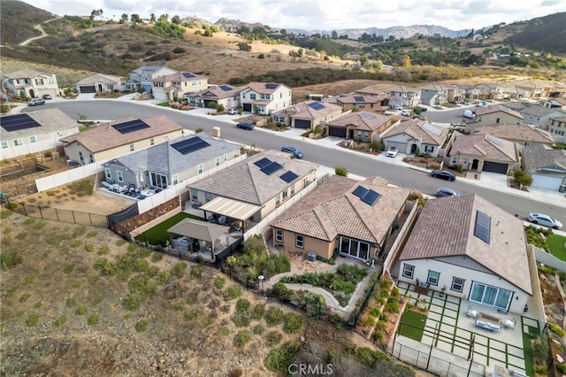 birds eye view of property with a mountain view