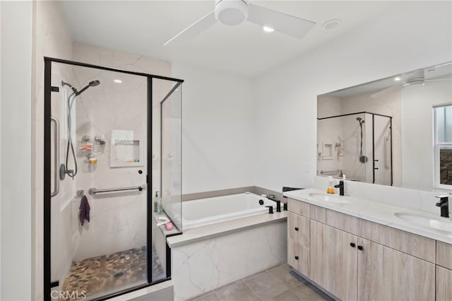 bathroom with vanity, tile patterned floors, and shower with separate bathtub