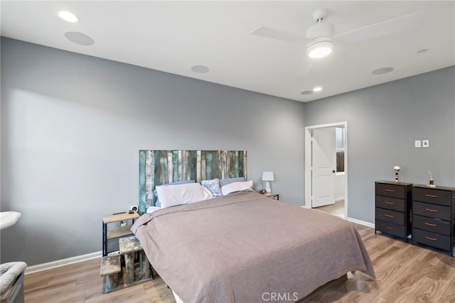 bedroom with ceiling fan and light wood-type flooring