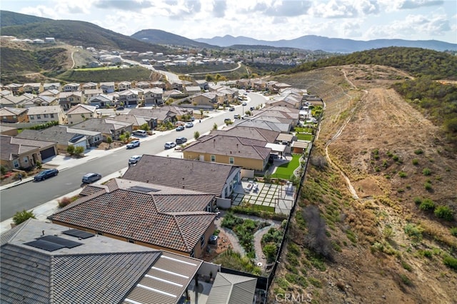 birds eye view of property featuring a mountain view