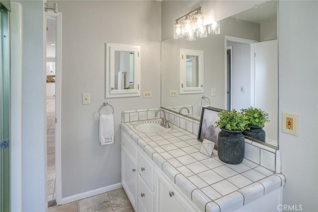 bathroom with vanity and tile patterned flooring