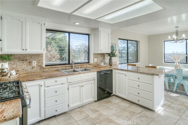 kitchen featuring sink, stainless steel gas range, dishwasher, white cabinetry, and kitchen peninsula