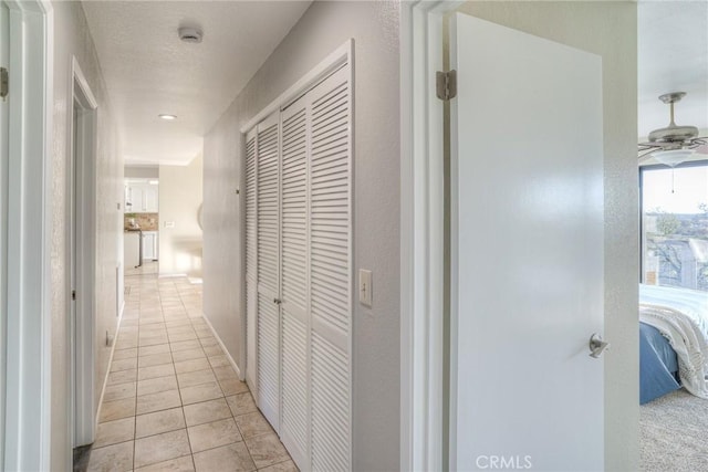 hallway with light tile patterned flooring