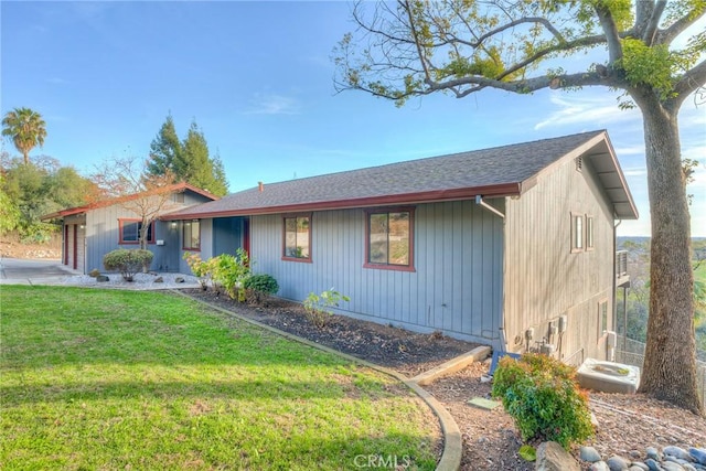 ranch-style home featuring a front yard