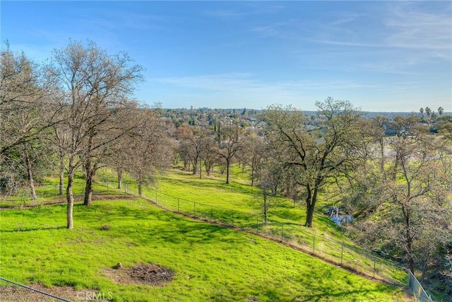 view of home's community with a yard and a rural view