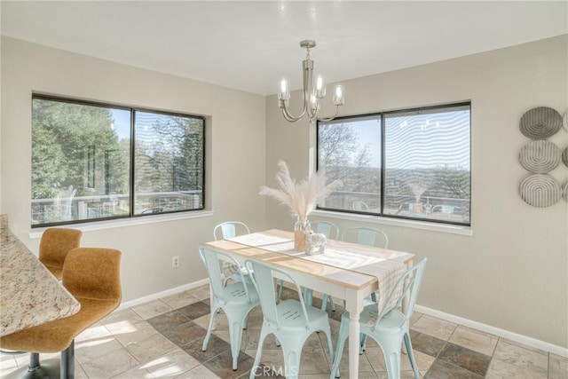 dining space featuring an inviting chandelier