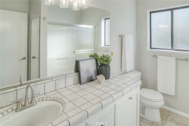 bathroom with vanity, an enclosed shower, tile patterned floors, and toilet