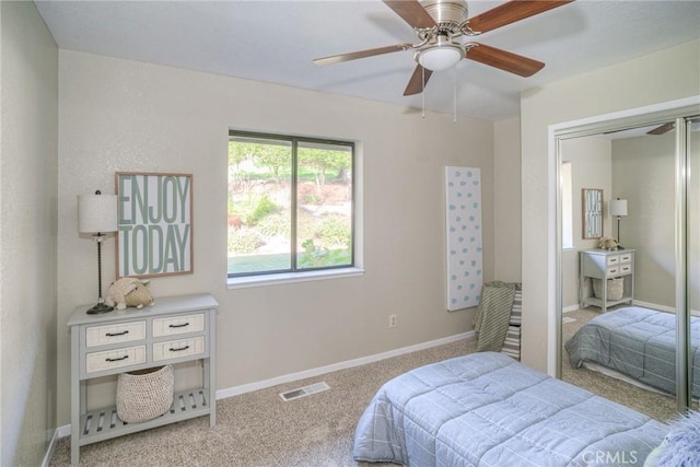 bedroom featuring light carpet and ceiling fan