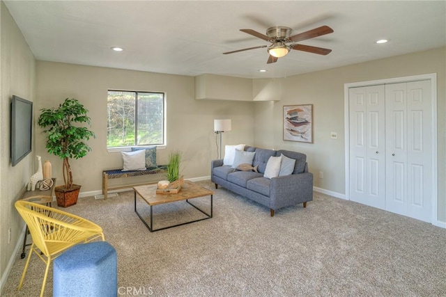 living room with carpet flooring and ceiling fan