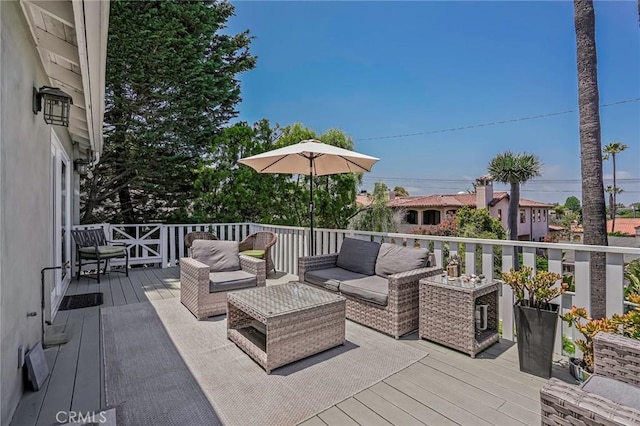 wooden deck with an outdoor living space