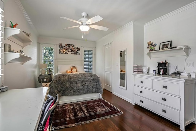 bedroom with ornamental molding, dark wood-type flooring, and ceiling fan