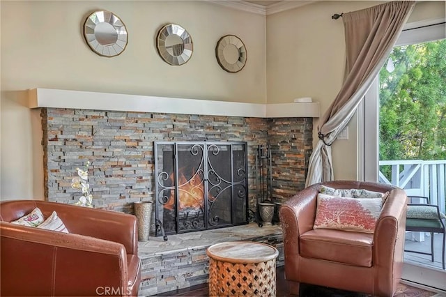 sitting room with a fireplace and plenty of natural light