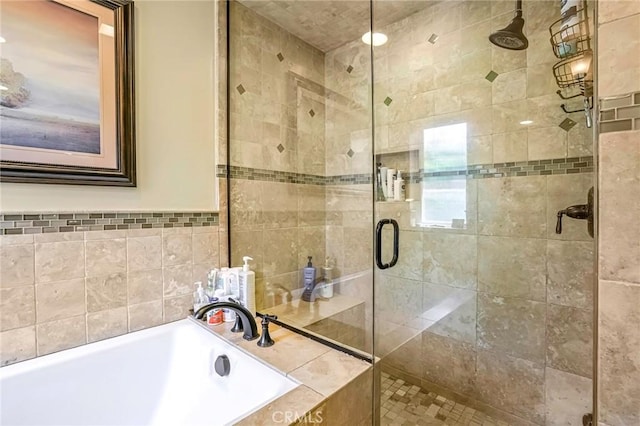 bathroom with separate shower and tub