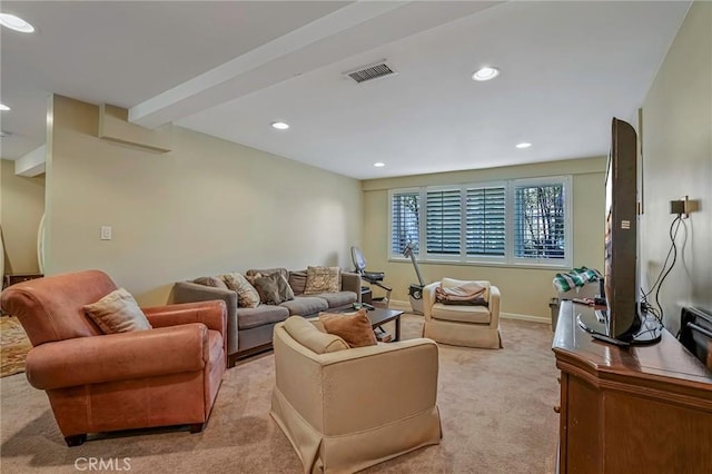 living room with beamed ceiling and light colored carpet