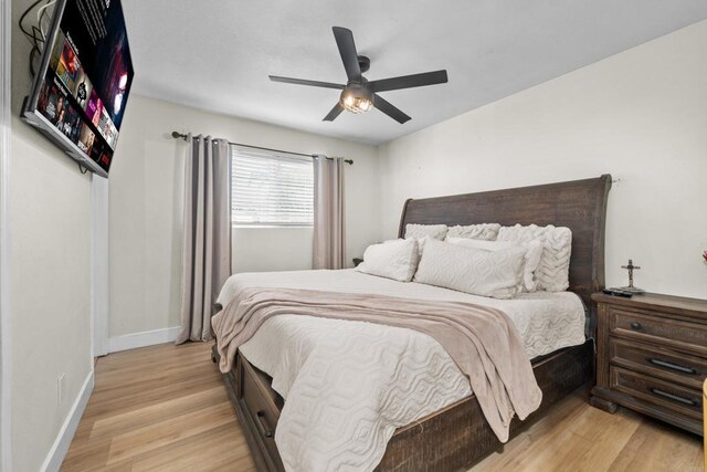 bedroom featuring ceiling fan and light hardwood / wood-style flooring