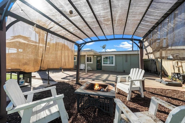 view of patio / terrace featuring a pergola and a fire pit