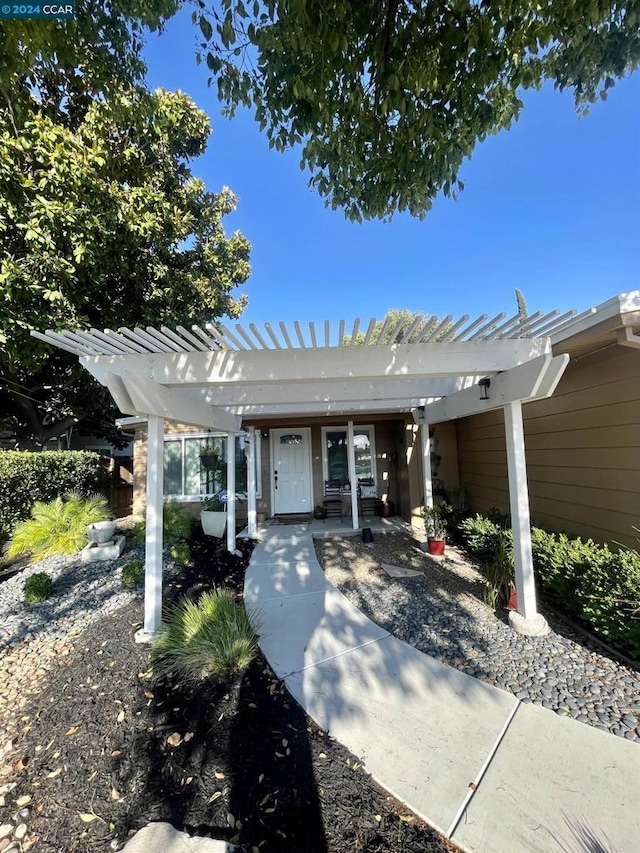 ranch-style house with a pergola