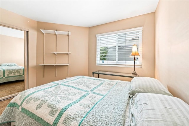 bedroom with a closet and carpet flooring