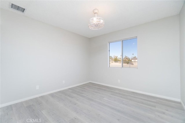 empty room with light wood-type flooring