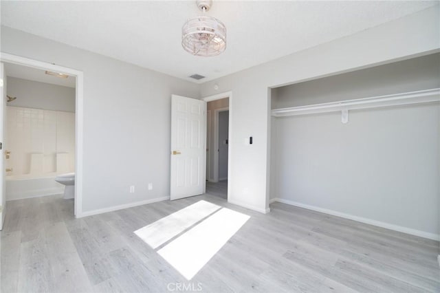 6213 Baileya Ave Unit 29, Palms, CA 92277 - unfurnished bedroom with a closet, baseboards, and wood finished floors