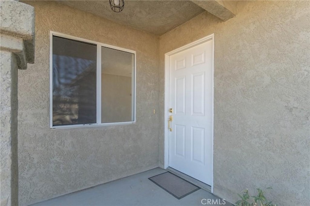 6213 Baileya Ave Unit 29, Palms, CA 92277 - doorway to property featuring stucco siding