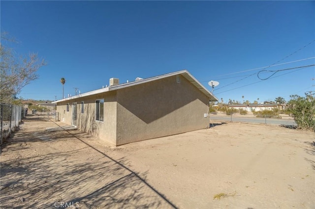 back of property with central air condition unit