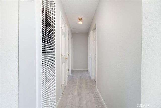 6213 Baileya Ave Unit 29, Palms, CA 92277 - hall with light wood-style flooring, baseboards, and a heating unit
