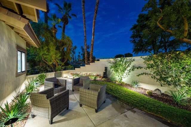 patio at twilight with an outdoor hangout area