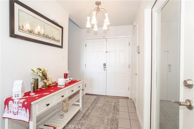 entrance foyer featuring light tile patterned floors and a chandelier