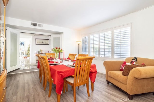 dining room with hardwood / wood-style floors