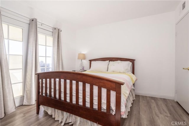 bedroom with light hardwood / wood-style floors