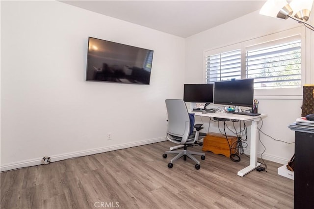 office space with light wood-type flooring