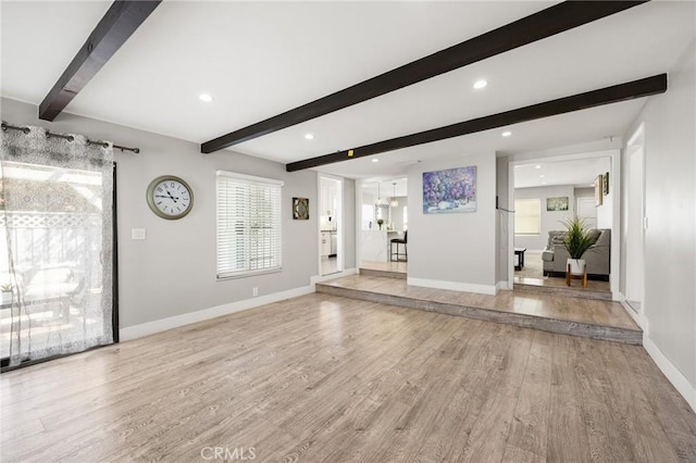 foyer entrance featuring light wood-type flooring and plenty of natural light