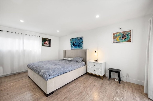 bedroom featuring wood-type flooring