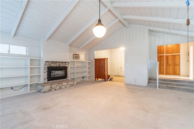 carpeted living room featuring high vaulted ceiling, built in shelves, beam ceiling, and a fireplace