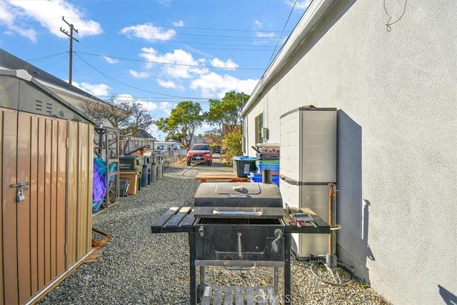 exterior space with a grill