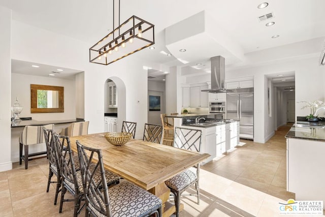 tiled dining room with sink