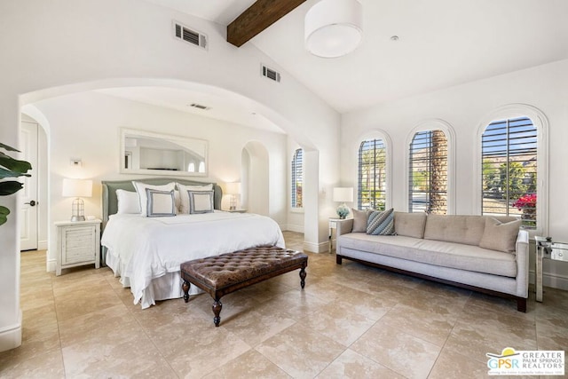 bedroom with lofted ceiling with beams