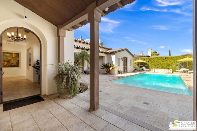 view of swimming pool with a patio area and pool water feature