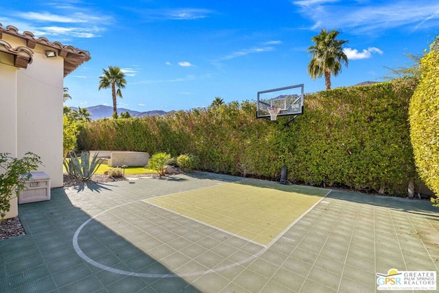 view of basketball court with a mountain view