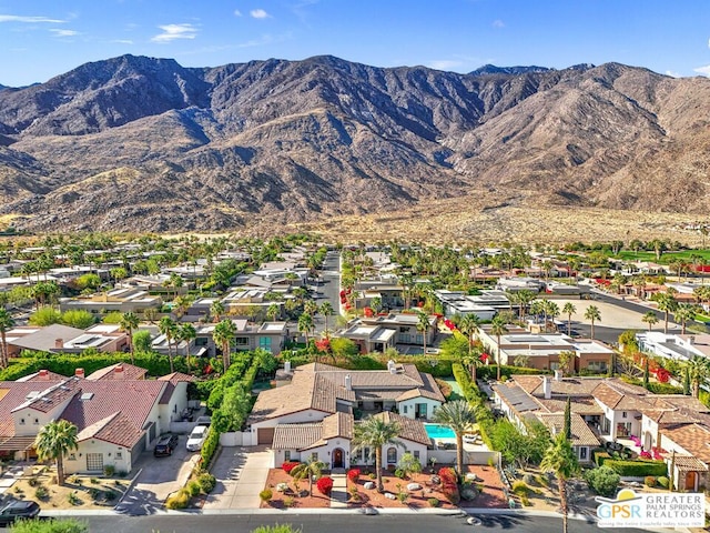 birds eye view of property with a mountain view