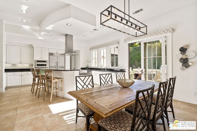 tiled dining area with sink