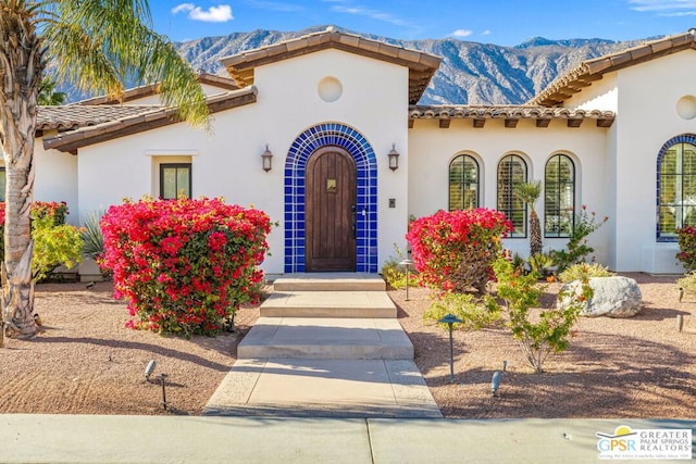 mediterranean / spanish house with a mountain view