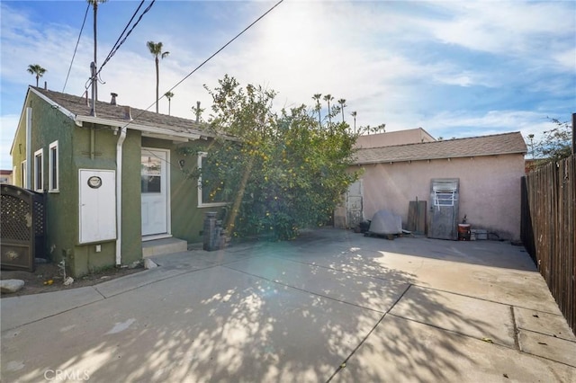 back of property with a patio area