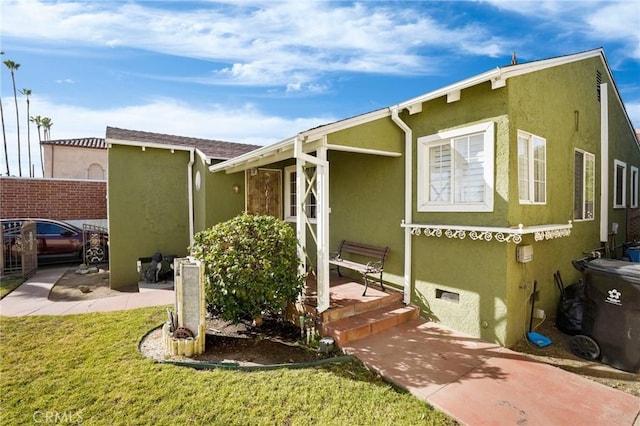 rear view of property with a yard